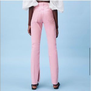 Pink high waisted ankle slit flare jeans